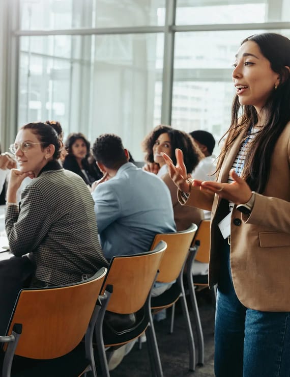 woman speaking at business meeting