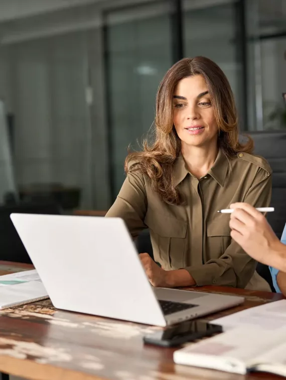 woman pointing at computer screen