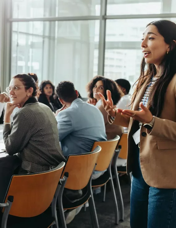 woman speaking at business meeting